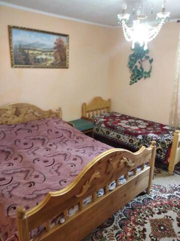 Фото номера Двухместный номер с двуспальной кроватью и дополнительной кроватью Лоджи Guest House Pid Lypamy г. Микуличин 11